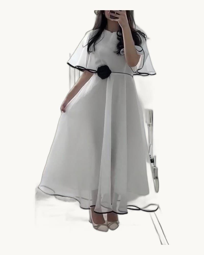 White Chiffon Maxi Dress with Black Trim and Floral Accent 1