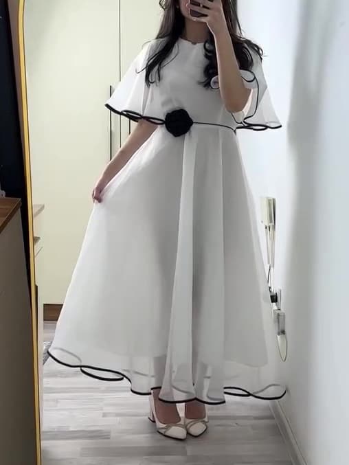 White Chiffon Maxi Dress with Black Trim and Floral Accent 1